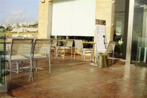 Empty patio with chairs and tables