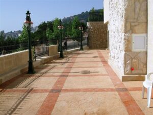 Elegant walkway with stone wall and chair