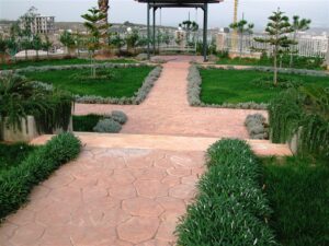 Garden path with manicured grass and trees