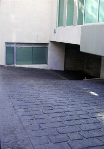 Urban building exterior with driveway ramp