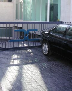 Close-up of parked car by gate