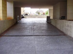 Covered driveway leading to building entrance