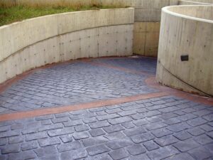Curved concrete path with stone texture