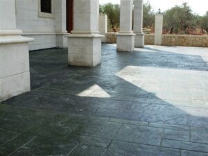 Stone patio with columns and trees