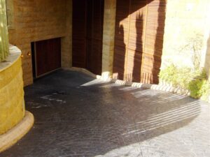 Stone driveway with shadow patterns