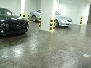 Underground parking with two parked cars