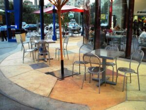 Outdoor cafe with empty metal chairs
