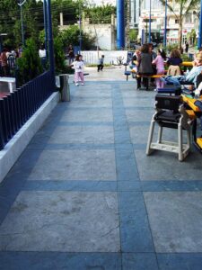 Outdoor area with people and tables