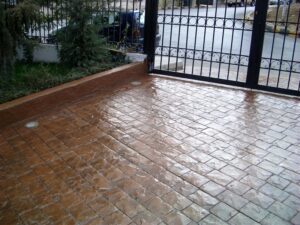 Rain-soaked brick driveway