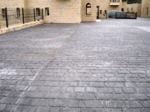 Stamped concrete driveway with brick pattern