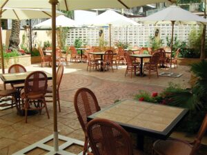 Empty outdoor dining area with parasols.