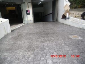 Parking garage entrance with concrete ramp