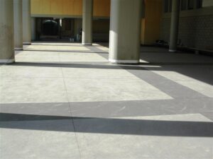 Concrete hallway with columns and shadows