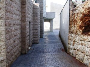Cobblestone path between stone walls