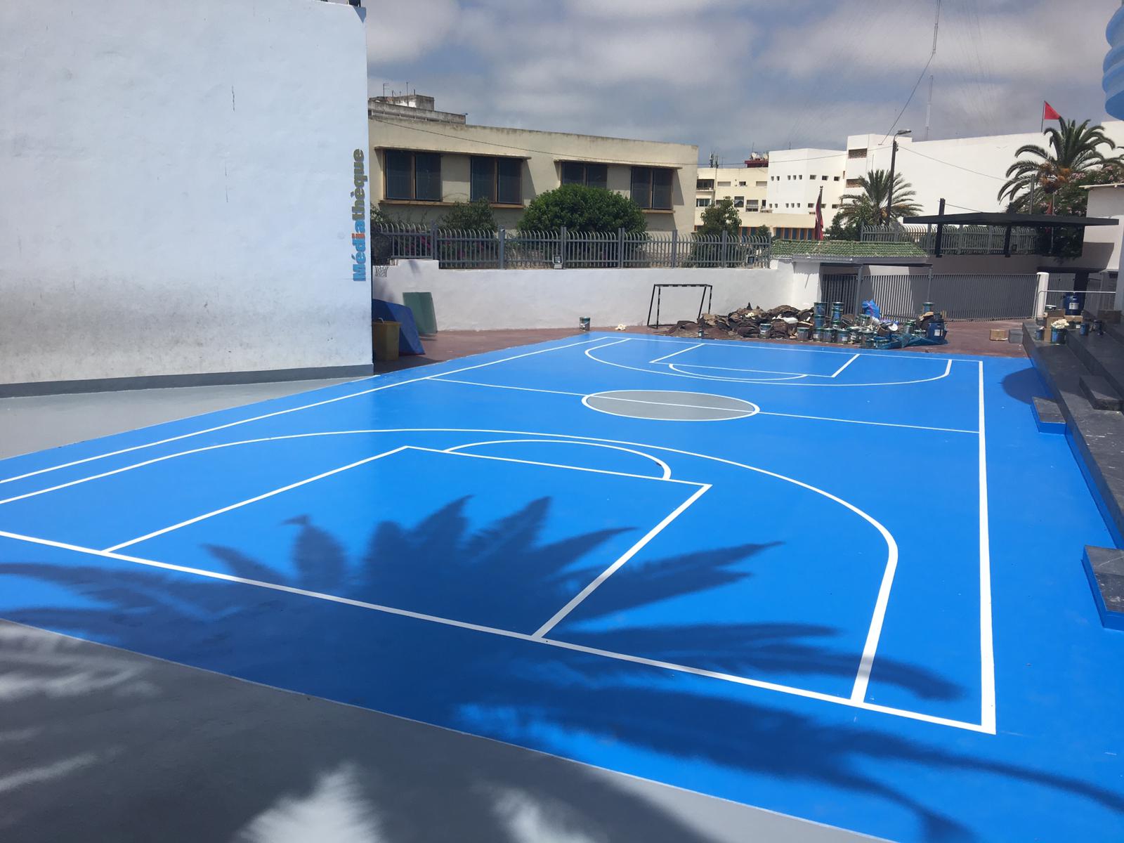 Sunny day on empty basketball court