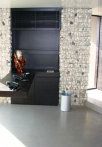 Minimalist workspace with cobblestone wall