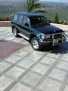 SUV parked on tiled driveway