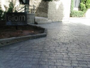 Modern office entrance with stone pavement