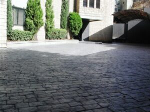 Paved courtyard with trees and shadows