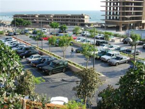 Cars parked near unfinished buildings