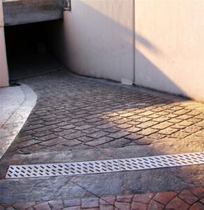 Brick driveway leading to a garage