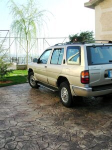 SUV parked on stone driveway