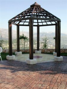 Wooden gazebo with mountain backdrop