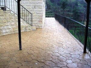 Pathway beside stone building with railing