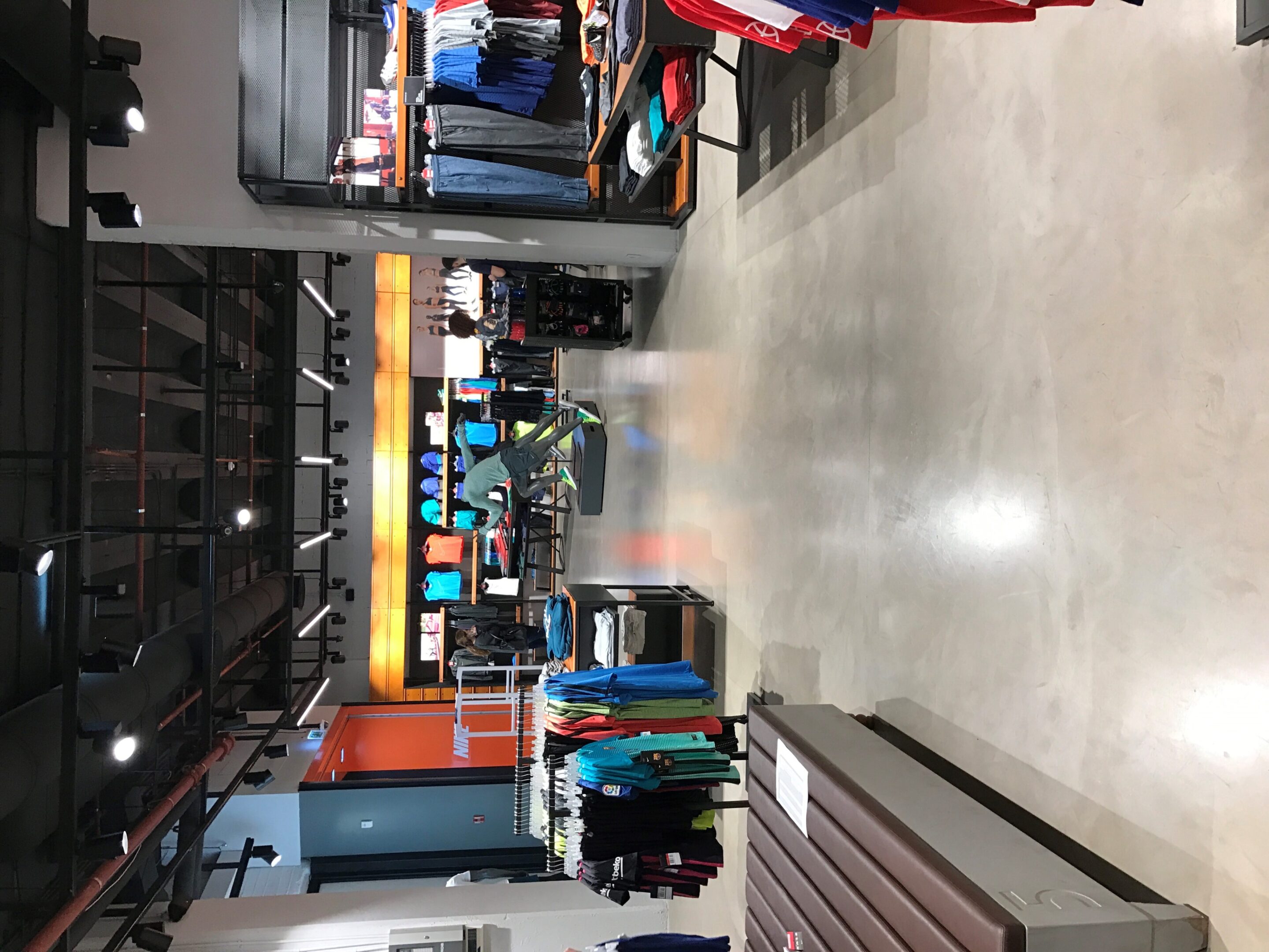 Modern retail space featuring apparel racks