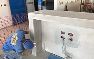 Construction worker smoothing concrete surface