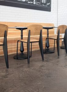 Empty cafe seating with wooden chairs