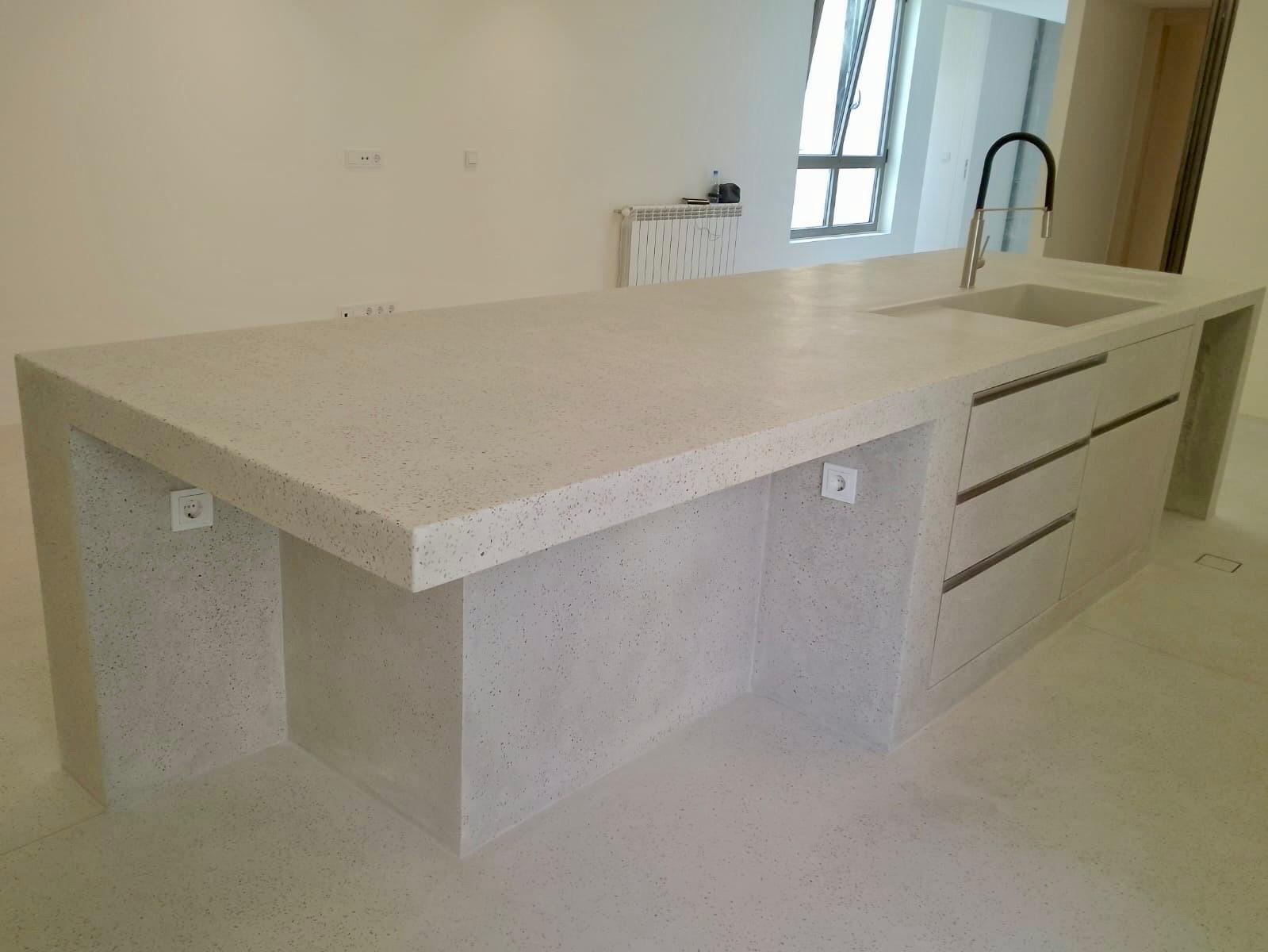 Cast concrete kitchen island countertop with integrated sink and waterfall sides, by TopCrete in Lebanon