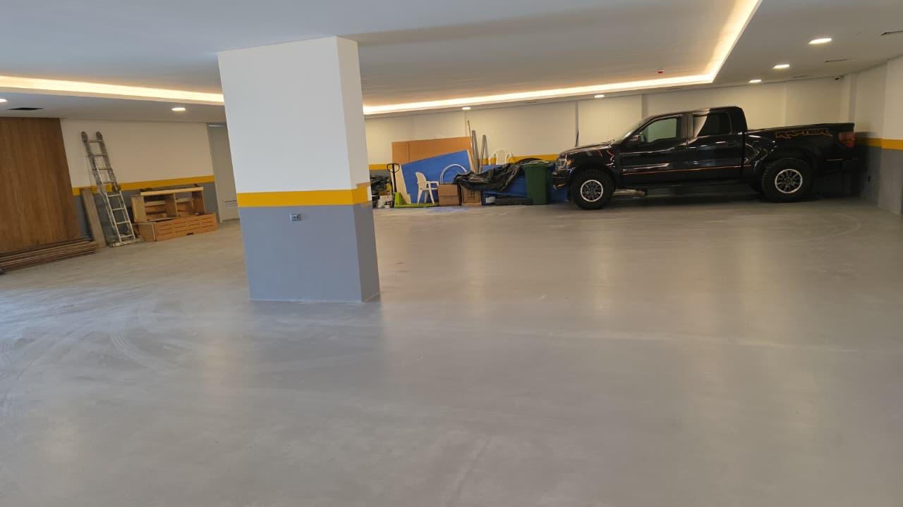 Seamless grey epoxy floor coating in an underground parkade in Lebanon by TopCrete