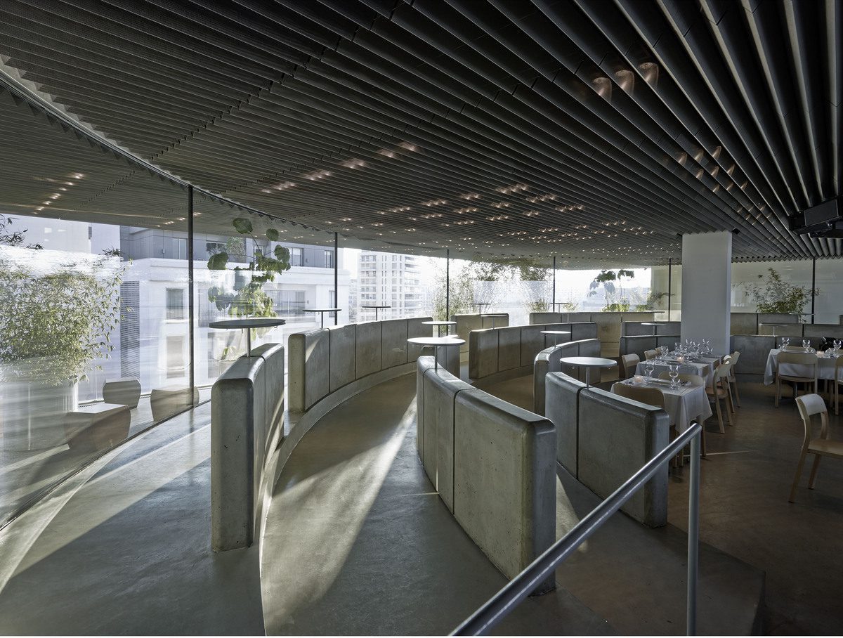 Microtopping floor and cast concrete banquettes in a rooftop restaurant, Lebanon
