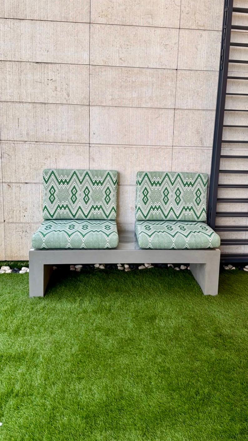 Precast concrete bench with upholstered cushions in a garden terrace, cast by TopCrete in Lebanon