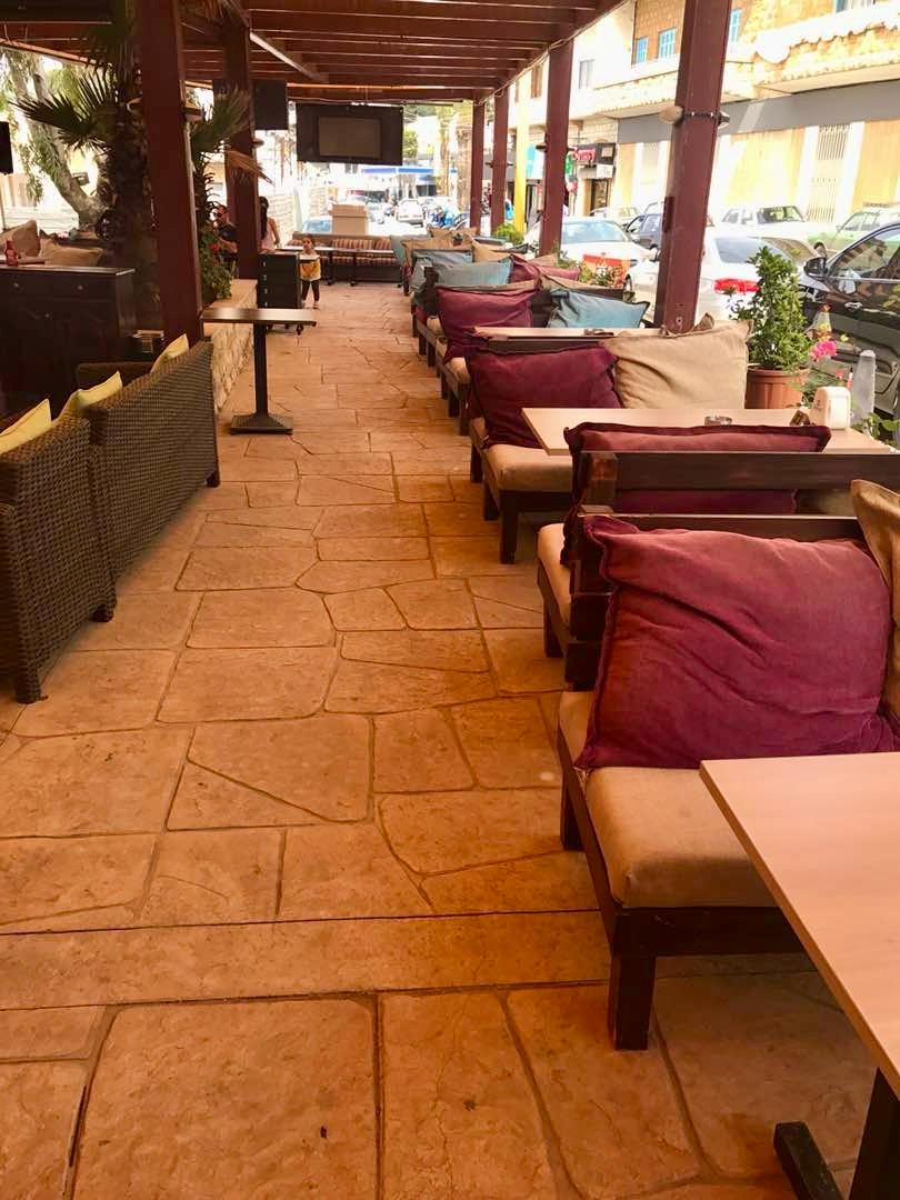 Stamped concrete flagstone terrace at a cafe in Lebanon by TopCrete