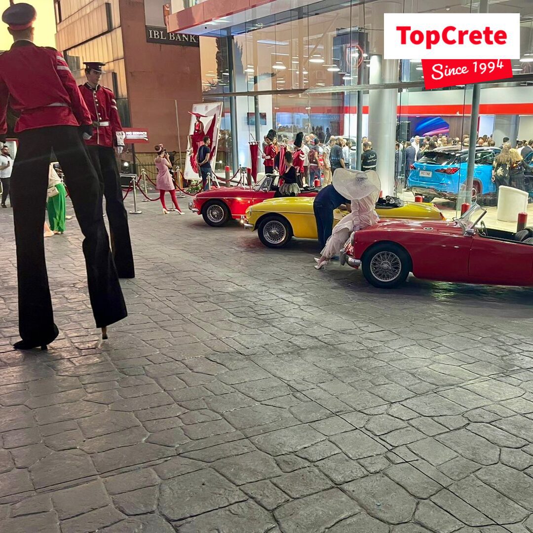 Stamped concrete forecourt at an evening showroom event in Lebanon